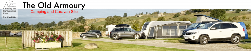 View of the Old Armoury Campsite showing caravans and motorhomes.